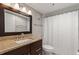 Bathroom with granite countertop vanity, large mirror and a shower at 974 E Michigan St # 974, Orlando, FL 32806