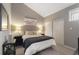 Cozy bedroom with neutral walls, closet, and lamps at 974 E Michigan St # 974, Orlando, FL 32806