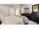 Neutral bedroom with closet and dark wood dresser at 974 E Michigan St # 974, Orlando, FL 32806