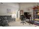 Home office featuring sofa, desk and display cabinet for collectables at 974 E Michigan St # 974, Orlando, FL 32806