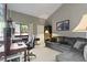 A bright home office has a desk, sofa and access to an outside patio at 974 E Michigan St # 974, Orlando, FL 32806
