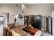 Vaulted ceiling living room with sofa, display cabinet and view to the landing at 974 E Michigan St # 974, Orlando, FL 32806