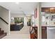 Open living room with a view from kitchen, plush sofa, and neutral color palette at 974 E Michigan St # 974, Orlando, FL 32806