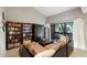 Living room with vaulted ceiling, bookcase and view to outside patio at 974 E Michigan St # 974, Orlando, FL 32806