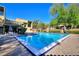 Community pool featuring lounge chairs and well-maintained landscaping at 974 E Michigan St # 974, Orlando, FL 32806