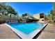 Large community pool surrounded by lush tropical landscape at 974 E Michigan St # 974, Orlando, FL 32806
