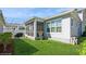 Well-maintained backyard featuring lush green grass and a screened-in porch at 985 Huntspoint St, Winter Garden, FL 34787