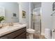 Bathroom featuring marble countertop, a glass shower, and modern fixtures at 985 Huntspoint St, Winter Garden, FL 34787