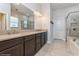 Bathroom featuring a double vanity and shower with glass door at 985 Huntspoint St, Winter Garden, FL 34787