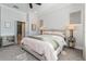 Serene bedroom with neutral tones, carpet, and plenty of natural light and an ensuite bathroom at 985 Huntspoint St, Winter Garden, FL 34787