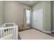 Bright Bedroom featuring light wallpaper, plush carpeting, and white trim at 985 Huntspoint St, Winter Garden, FL 34787