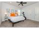 Bright bedroom features a ceiling fan, grey carpet, and ample natural light at 985 Huntspoint St, Winter Garden, FL 34787