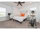 Bright bedroom with a ceiling fan, desk area, and exercise machine at 985 Huntspoint St, Winter Garden, FL 34787