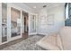 Bright room featuring glass doors, blue paneled walls, beige sofa, and a neutral area rug at 985 Huntspoint St, Winter Garden, FL 34787