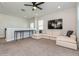 Upstairs bonus room with comfortable seating, plush carpet and ample lighting at 985 Huntspoint St, Winter Garden, FL 34787