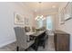 Dining room featuring a dining table with neutral chairs, and a decorative chandelier at 985 Huntspoint St, Winter Garden, FL 34787