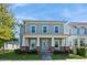 Charming two-story home with a welcoming front porch and manicured lawn at 985 Huntspoint St, Winter Garden, FL 34787