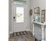 Bright foyer with stylish decor, wood-look tile flooring, and ample natural light at 985 Huntspoint St, Winter Garden, FL 34787