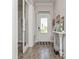 Welcoming foyer featuring light walls, stylish wood-look floors, and bright natural light at 985 Huntspoint St, Winter Garden, FL 34787