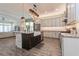 Open concept kitchen with a large island, modern appliances, and plenty of cabinet space at 985 Huntspoint St, Winter Garden, FL 34787
