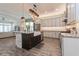 Spacious kitchen with a large island, wooden floors and modern appliances at 985 Huntspoint St, Winter Garden, FL 34787