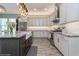 Kitchen with wooden floors, stainless appliances, and quartz counters at 985 Huntspoint St, Winter Garden, FL 34787