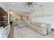 Living room with a decorative white shelf and an open design to the kitchen at 985 Huntspoint St, Winter Garden, FL 34787