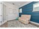 Bright office with custom blue accent wall, wood-look floors, and modern decor at 985 Huntspoint St, Winter Garden, FL 34787