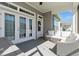 Relaxing outdoor patio with comfortable seating, features double french doors and a ceiling fan at 985 Huntspoint St, Winter Garden, FL 34787