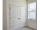 Neutral bedroom featuring carpet, closet, and a bright window view at 1009 Hendon Loop, Davenport, FL 33837