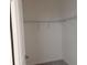 Walk-in closet with rod and shelving for storage at 1009 Hendon Loop, Davenport, FL 33837