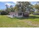 Exterior view of the home showing a white picket fence, and large yard at 1016 E Fillmore Ave, Orlando, FL 32809