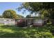 Charming single-story home with a welcoming screened porch and a well-maintained lawn at 1016 E Fillmore Ave, Orlando, FL 32809