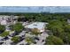 Aerial view of a shopping center with a Publix Market, parking lot, and surrounding trees at 1018 Stetson St, Orlando, FL 32804