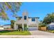 Beautiful two-story home with a manicured front yard, stylish design, and a striking green front door at 1018 Stetson St, Orlando, FL 32804