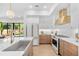 Modern kitchen with white cabinets, marble countertops, and a stainless steel sink at 1018 Stetson St, Orlando, FL 32804