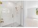 Modern shower featuring gold fixtures, glass enclosure, and stylish tile work at 1018 Stetson St, Orlando, FL 32804