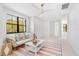 Bright sitting room with a large window and modern ceiling fan at 1018 Stetson St, Orlando, FL 32804