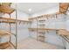 Spacious walk-in closet with custom wooden shelving and ample storage at 1018 Stetson St, Orlando, FL 32804