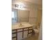 Bathroom with an extended vanity, faucet, sink, mirror, and toilet with a shower and tub combo at 1021 S Hiawassee Rd # 3922, Orlando, FL 32835