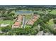 Stunning aerial view of the community with lake and golf course views from numerous homes at 1377 Tappie Toorie Cir, Lake Mary, FL 32746
