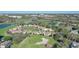 Overhead of Turnberry community showing golf course, green spaces, bodies of water and buildings at 1377 Tappie Toorie Cir, Lake Mary, FL 32746