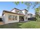 Exterior of home with a spacious backyard and covered patio area at 1377 Tappie Toorie Cir, Lake Mary, FL 32746