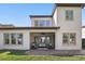 Exterior of home with a large backyard and covered patio perfect for outdoor entertaining at 1377 Tappie Toorie Cir, Lake Mary, FL 32746