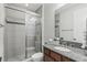 Bathroom featuring a glass enclosed shower and granite countertops at 1377 Tappie Toorie Cir, Lake Mary, FL 32746