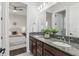 Bathroom showcasing granite countertops, double sinks, and a door to the commode at 1377 Tappie Toorie Cir, Lake Mary, FL 32746