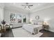 Bright bedroom with tray ceiling, fan, and view of backyard at 1377 Tappie Toorie Cir, Lake Mary, FL 32746