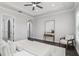 Well-lit primary bedroom featuring ceiling fan, neutral color palette and tray ceiling at 1377 Tappie Toorie Cir, Lake Mary, FL 32746