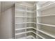 Walk-in closet with built-in shelves and ample storage space at 1377 Tappie Toorie Cir, Lake Mary, FL 32746