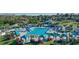 Resort-style community pool featuring lap lanes, splash area, cabanas, and ample lounge seating at 1377 Tappie Toorie Cir, Lake Mary, FL 32746